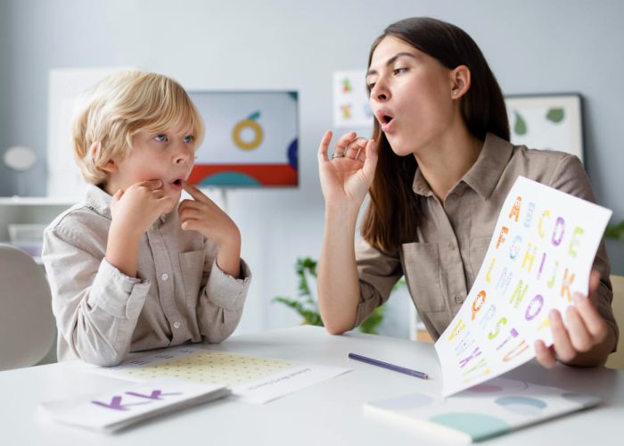 woman-doing-speech-therapy-with-a-little-blonde-boy-1